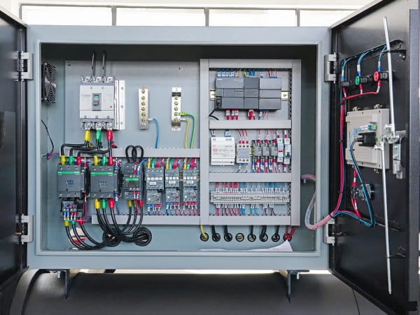 Before: Control box with PLC system